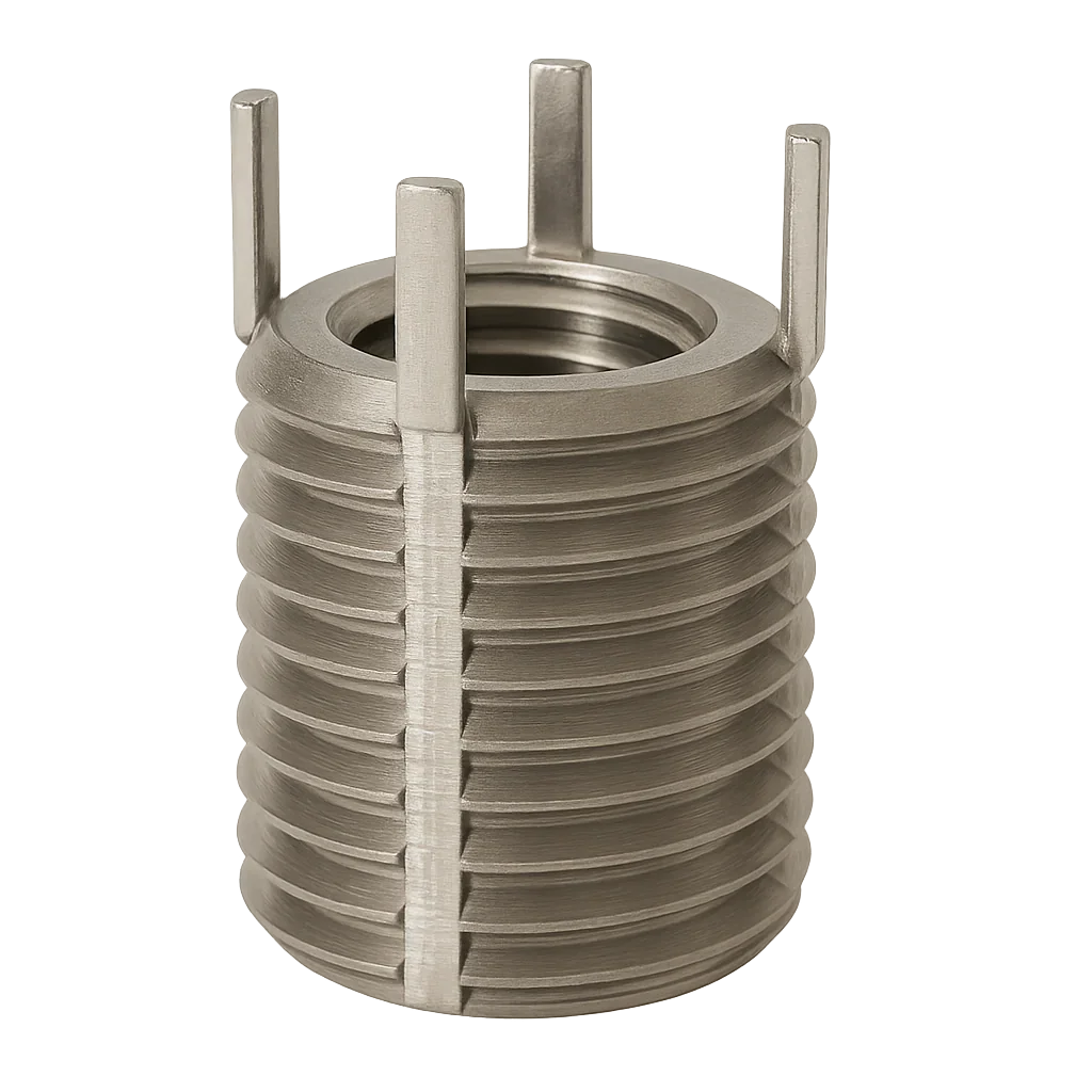 Close-up of a silver-toned metal threaded insert with four protruding tabs, used in metal processing and hardware